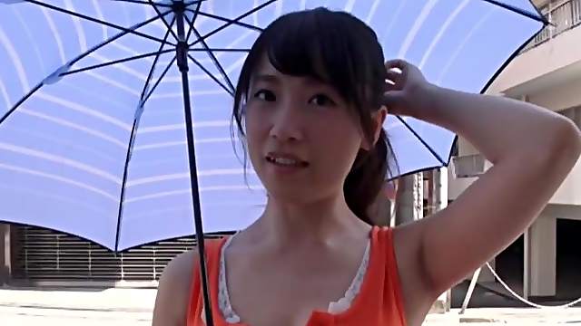 Asian chick Nagase Mami drops on her knees to give a titjob