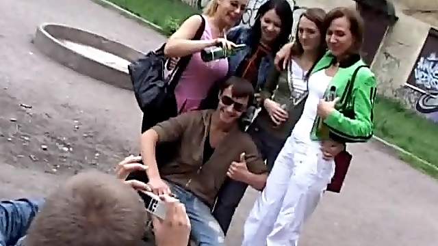 Russian guys pick up a few girls and stroke their bodies indoors