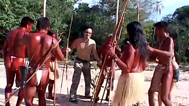 Naughty Japanese girl gets fucked by a tribe in jungles