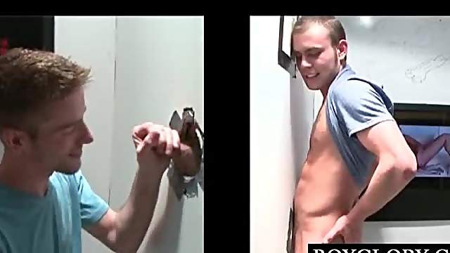 Lusty teen guy having gay oral sex on gloryhole