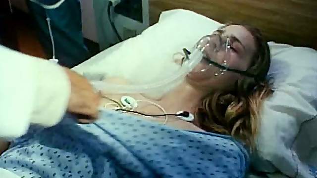 Gorgeous Blonde Babe Kathleen Kinmont Laying Topless On a Hospital Bed