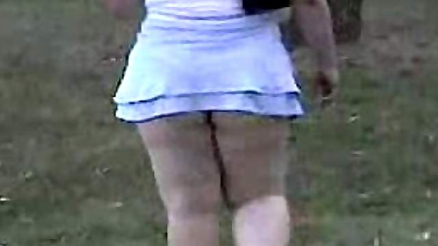 Chubby girl in extremely short skirt gets caught on a spy cam