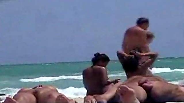 Voyeur's cam catches an Asian pussy on a nude beach