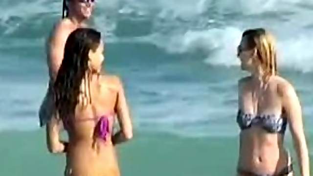Jessica Alba wearing a purple bikini gets caught on voyeur's cam on a beach