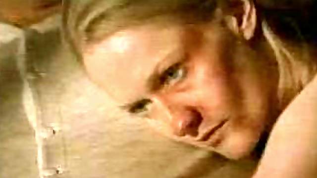 Topless Paula Malcomson Lying in Bed with a Moustached Man