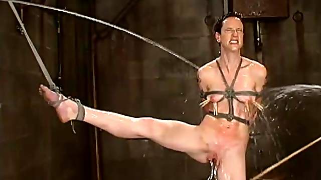 Short-haired brunette gets toyed with a strap-on by her mistress