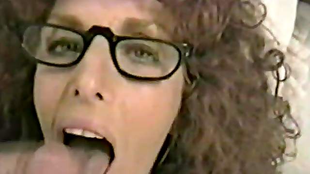 Curly Haired Brunette Wearing Glasses Does an Outstanding Blowjob