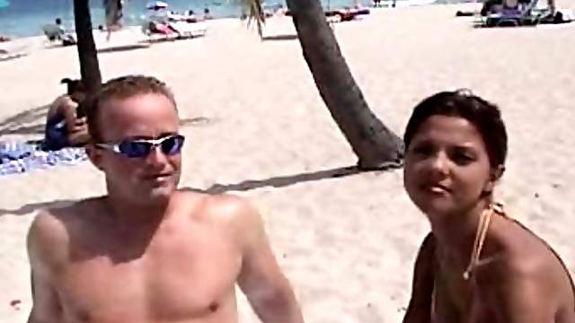 A sizzling redhead Doris is loving it on the beach