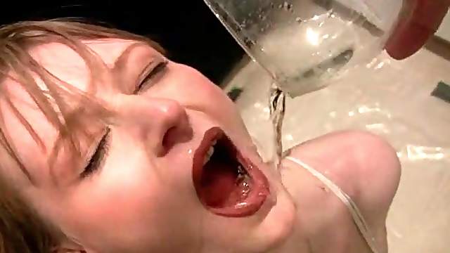 Kinky blonde tramp filling three glasses with her piss