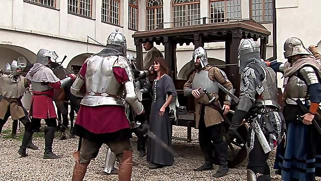 Two knights fuck a peasant woman in a wooden house