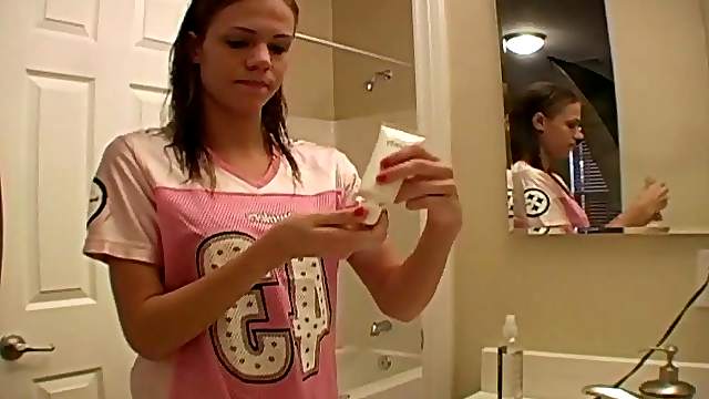 Dashing teen fairy applies her make up in front of the mirror