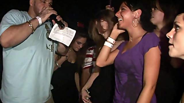 A few slutty chicks flash their butts in a club in voyeur video