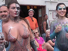 Funny amateur damsel showcasing her big tits and nice ass in a reality street party outdoor