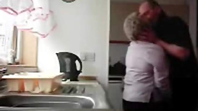 Chubby granny gets fondled in the kitchen by her hubby