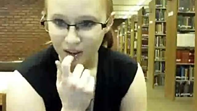 Tattooed amateur blonde in glasses flashes her small tits