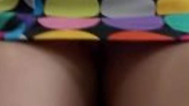 Amateur girl wearing a miniskirt gets caught on a voyeur's cam