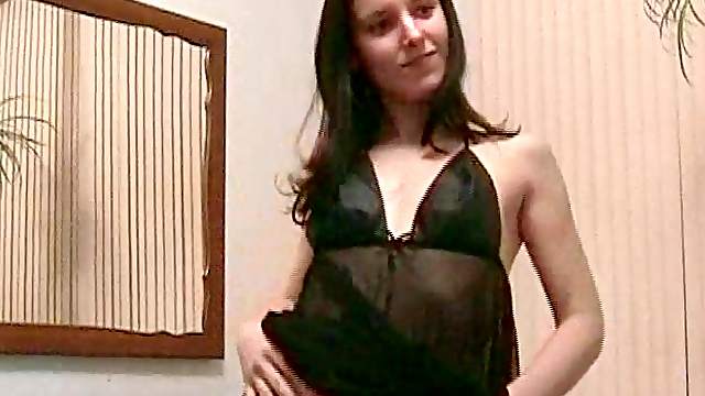 Lingerie-clad babe with a beautiful body playing with her shaved pussy