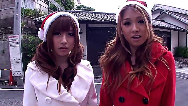 Two depraved Japanese Santa girls ride a shaft by turns in FFM reality
