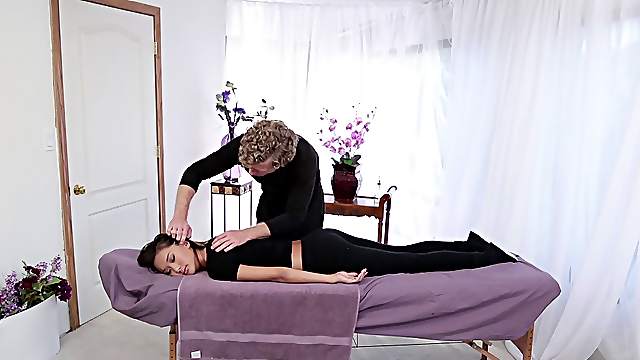 A shy girl seduced to have sex on the massage table