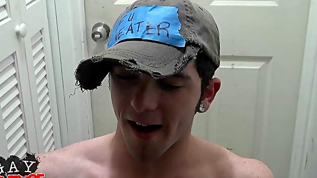 A sexy gay college guy on his knees showing off his blowjob skills