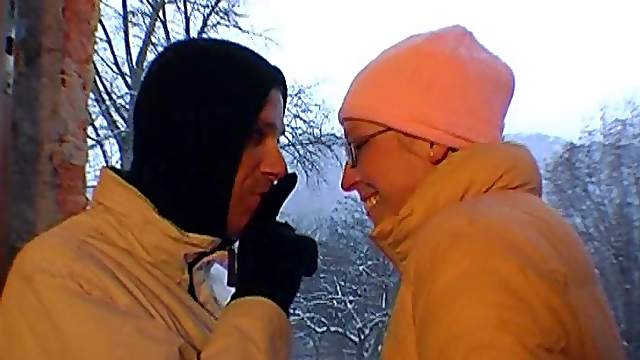 Girlfriend with glasses gives outdoor blowjob on a snowy day