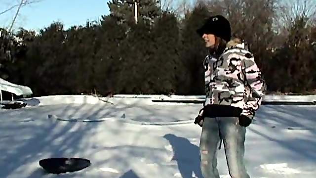 Britney Spring plays in the snow in some very tight jeans