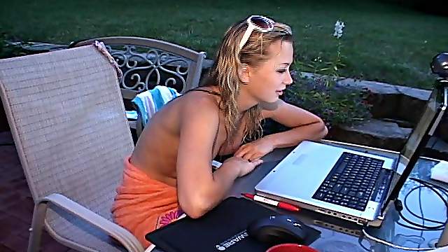 Blonde slut chatting on the computer while her tits are out