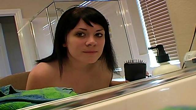 Sultry brunette with nice big tits blow-drying her hair