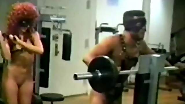 Strange couple hit the gym together then fuck with a strap on in POV