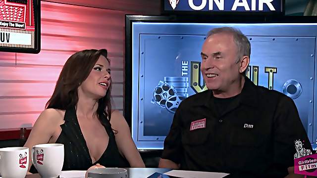 Sizzling porn star with great juggs laughing and chatting backstage