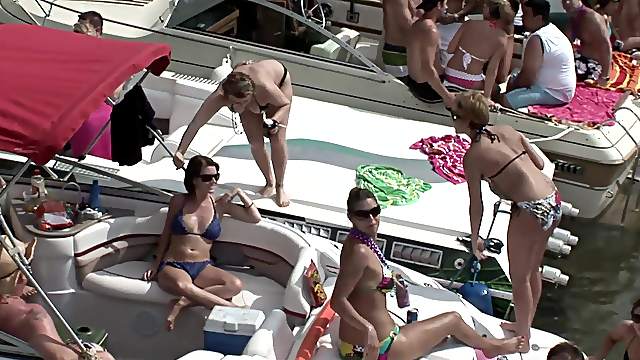 Bikini-clad brunette with a great body flashing her tits and pussy in public