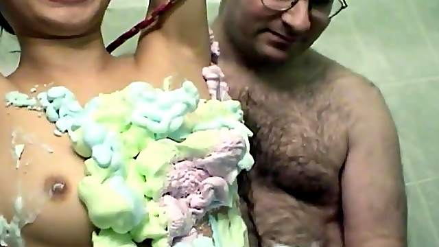 Asian babe roped up and covered in cream