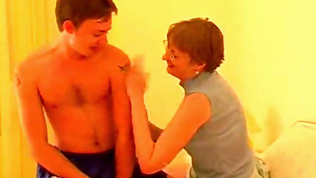 Short haired milf in glasses enjoys fucking younger guys hardcore
