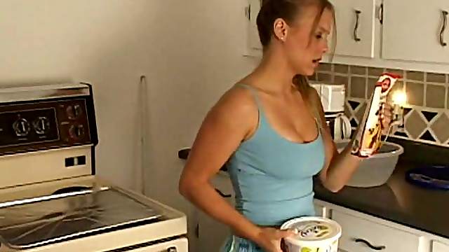 Playful teen babe showing her natural tits while cooking