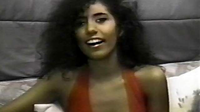 Curly haired woman with small tits sucking a kinky dude's dick