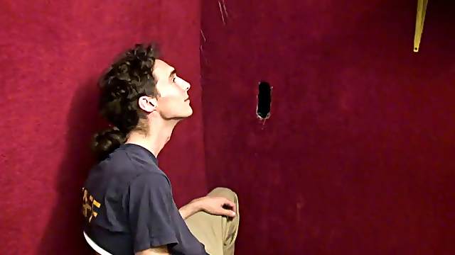 Sexy white gay boy sucks a black cock at the gloryhole