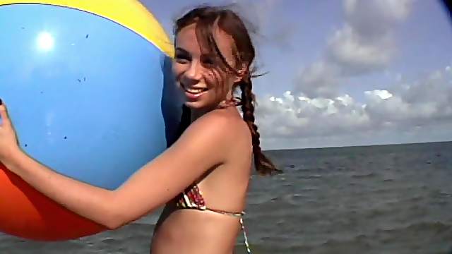 Pigtails brunette in bikini playing outdoor then fucked
