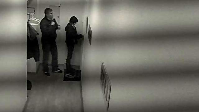 Mischievous Brunette Boldly Bangs in a Public Hallway