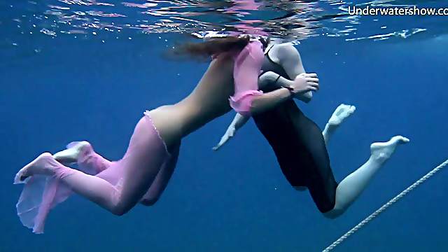 Two sexy babes strip down while diving in the ocean