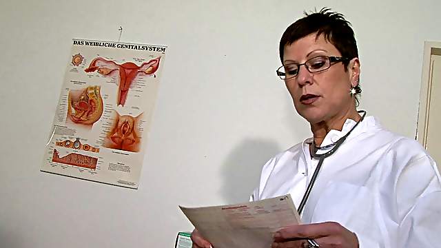 Short-haired MILF doctor with a wet pierced pussy masturbating