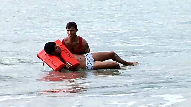 Horny gay fellow fucks a lifeguard on a nice beach