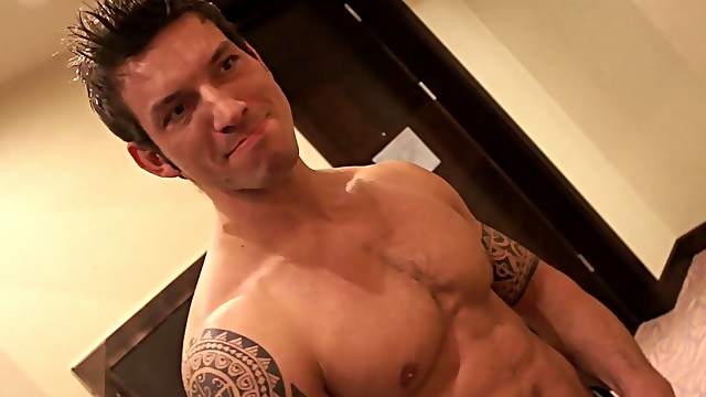 Good-looking stallion is happy to make a guy's cock stiff