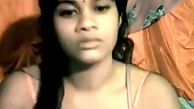 Dark indian beauty does a striptease for the webcam