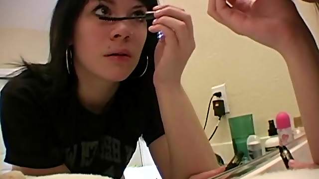 Long hair Andy dressing up infront of bedroom mirror