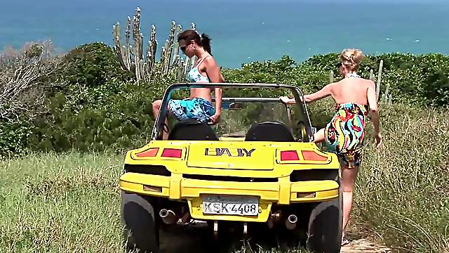 Tarra White and Aneta Keys take a leisurely stroll along the beach.