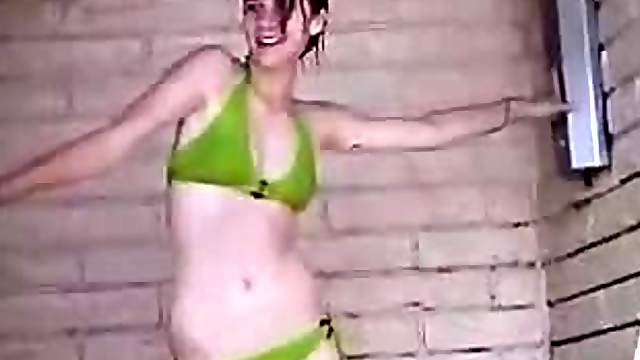 Teen in bikini trying to have a sexy shower