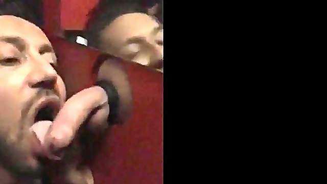 Cute guy sucks hung cock through gloryhole, gets cum in his mouth and swallows