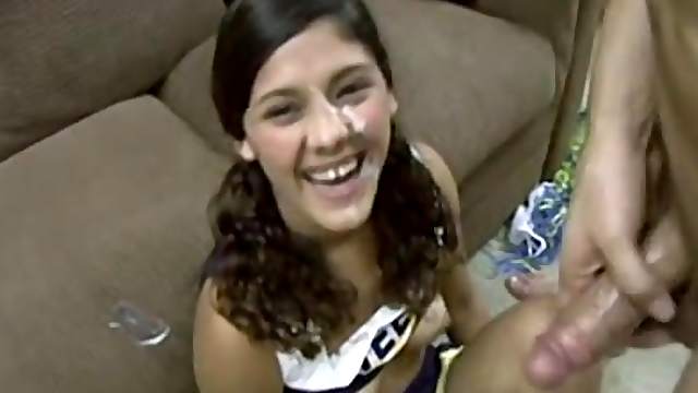 Brunette cheerleader gets her wet cunt pounded on the couch