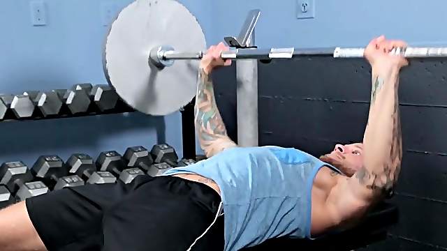 Long haired muscled gay dude gets a cumshot in the gym