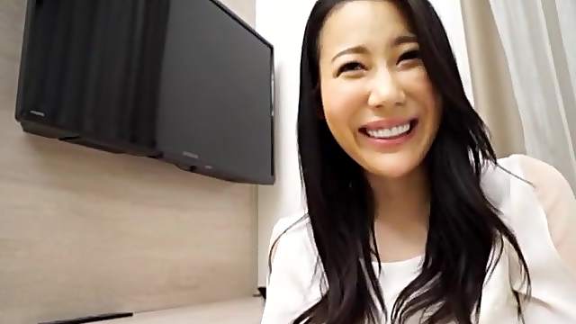 Smiling Japanese brunette MILF gets her tits licked and pussy fucked